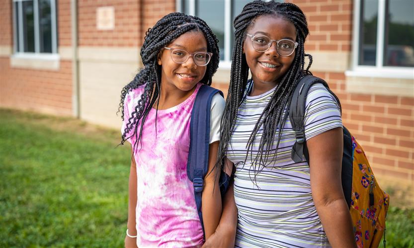 Two girls smile